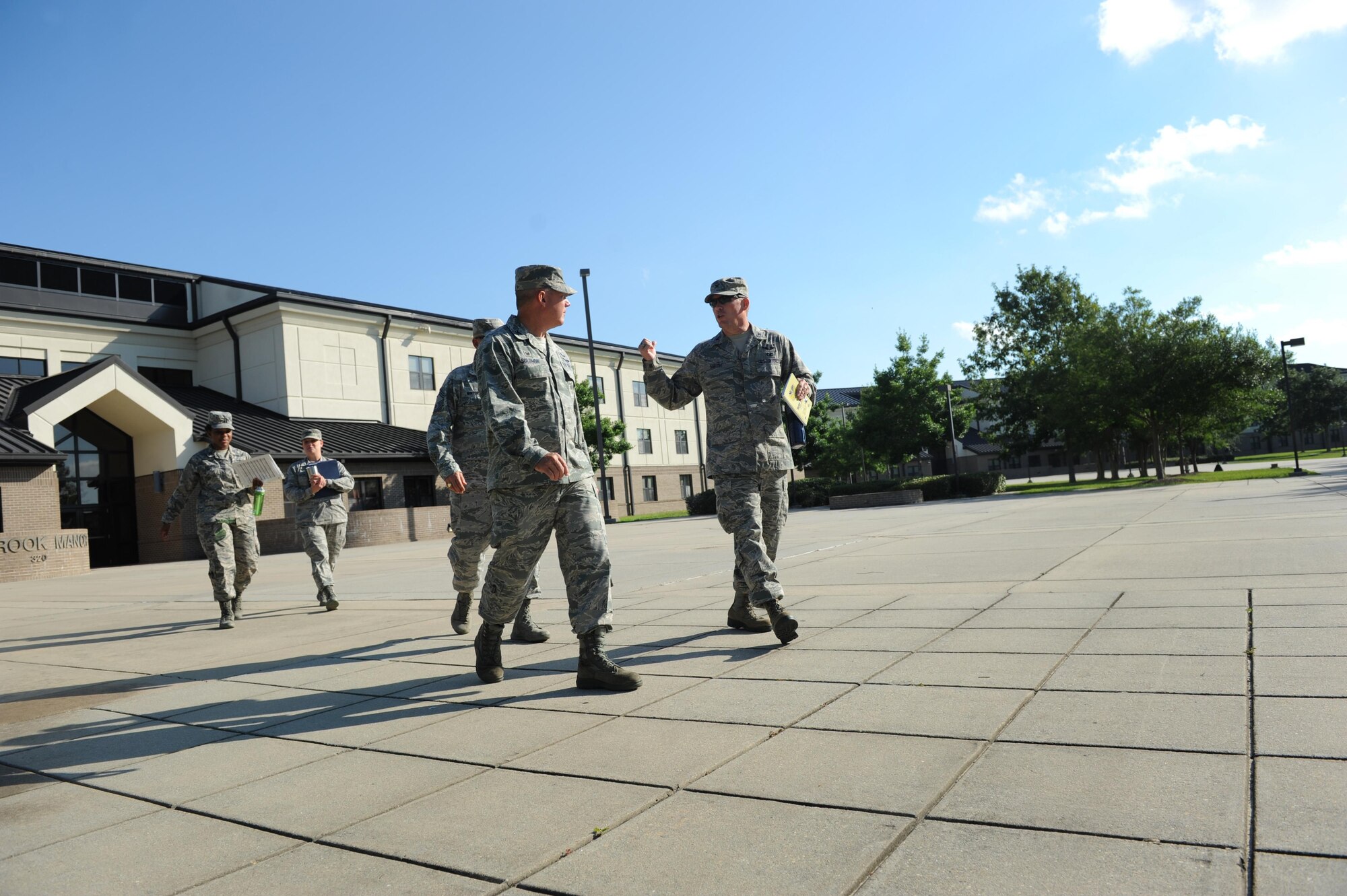 Col. C. Mike Smith, 81st Training Wing vice commander, talks with Col. Scott Solomon, 81st Training Group commander, during an immersion tour June 22, 2016 on Keesler Air Force Base, Miss. The purpose of the tour was to become familiar with the group’s mission, operations and personnel. (U.S. Air Force photo by Kemberly Groue/Released)