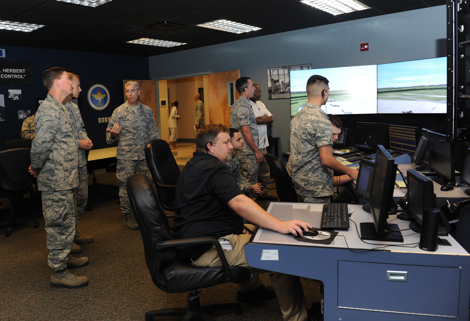 Lt. Col. Steven Mullins, 334th Training Squadron commander, briefs Col. C. Mike Smith, 81st Training Wing vice commander, on the air traffic control tower simulator training course at Cody Hall during an 81st Training Group immersion tour June 22, 2016 on Keesler Air Force Base, Miss. The purpose of the tour was to become familiar with the group’s mission, operations and personnel. (U.S. Air Force photo by Kemberly Groue/Released)