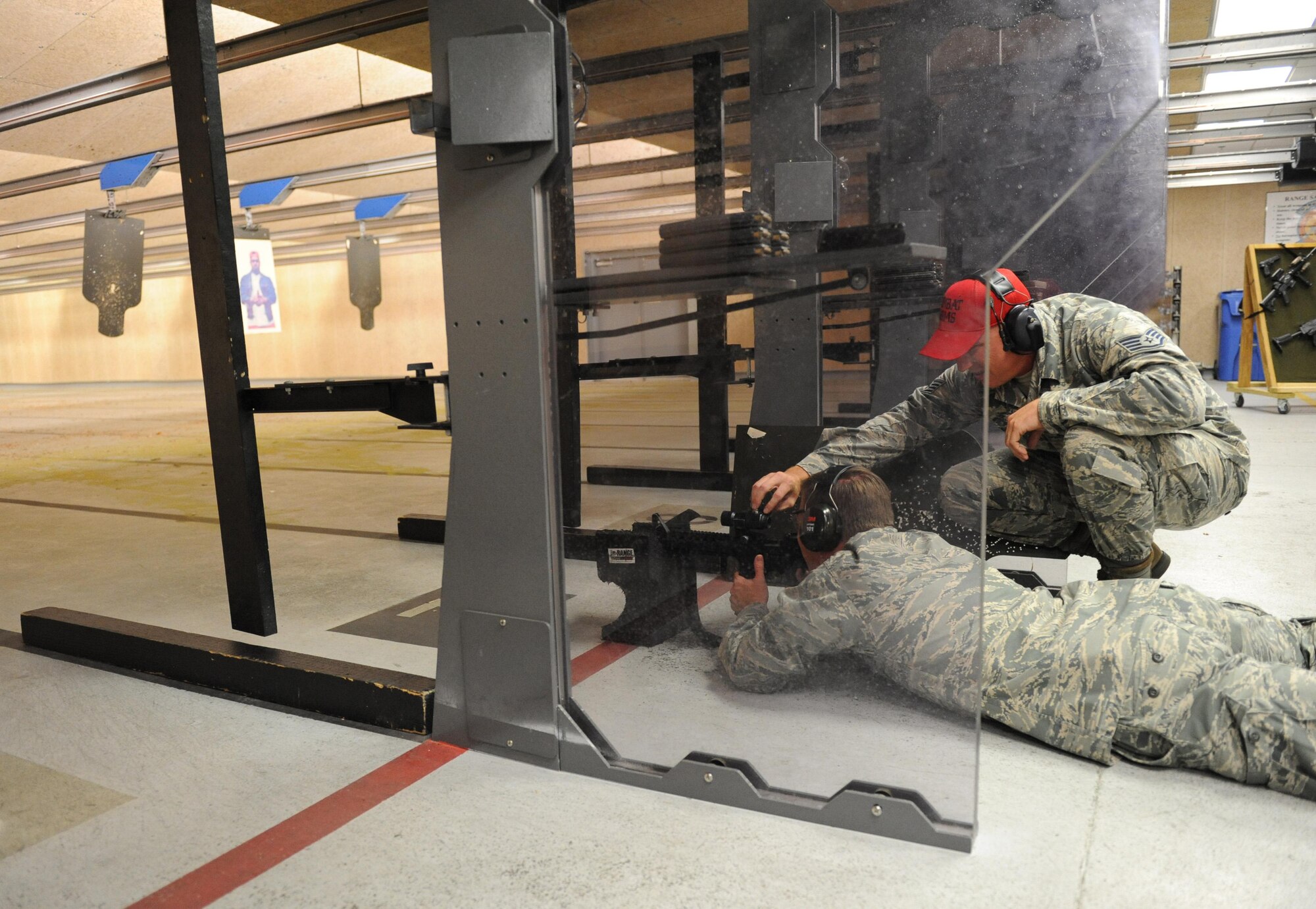 Col. C. Mike Smith, 81st Training Wing vice commander, receives weapon operation instructions from Staff Sgt. Jared Miller, 81st Security Forces Squadron combat arms instructor, at the Combat Arms Training and Maintenance building during an 81st Mission Support Group immersion tour June 23, 2016 on Keesler Air Force Base, Miss. The purpose of the tour was to become familiar with the group’s mission, operations and personnel. (U.S. Air Force photo by Kemberly Groue/Released)