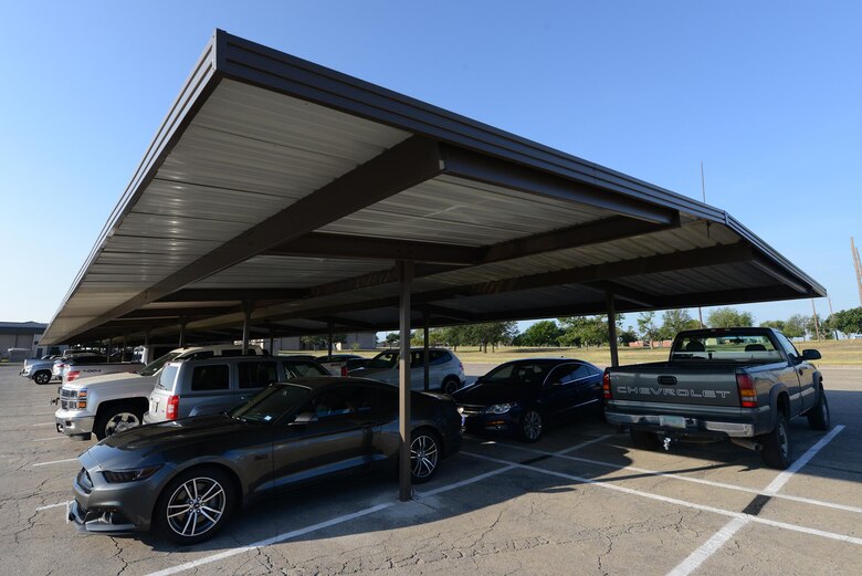 The recently moved vehicle sun-shades stand at the single officer dorms on Laughlin Air Force Base, Texas, June 29, 2016. The 47th Civil Engineer Squadron and dormitory managers came together to move vehicle sun-shades from a vacant lot to the single officer dormitory where they can be of use again. (U.S. Air Force photo/Airman 1st Class Brandon May)