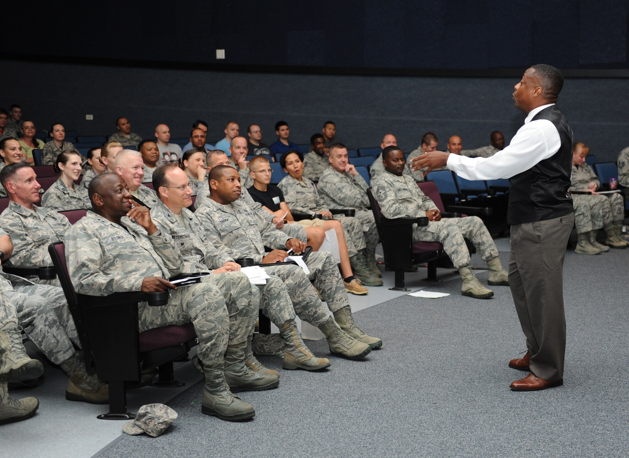 Retired Chief Master Sgt. Anthony Brinkley speaks at a leadership and personal development seminar at the Welch Theater June 24, 2016 on Keesler Air Force Base, Miss. Brinkley, with more than 28 years of military experience, is delivering seminars highlighting leadership development, motivational speaking and team building to military members and civilians at all 2nd Air Force bases. (U.S. Air Force photo by Kemberly Groue/Released)