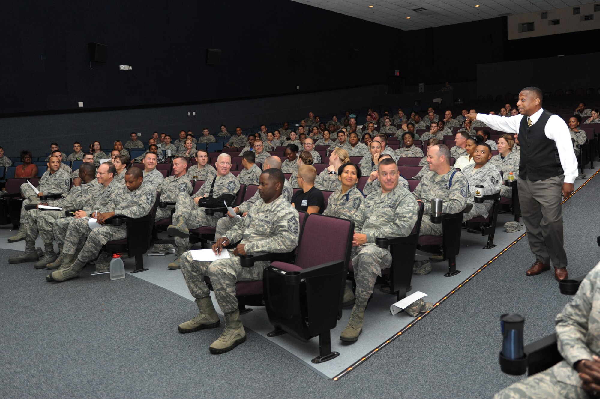 Retired Chief Master Sgt. Anthony Brinkley speaks at a leadership and personal development seminar at the Welch Theater June 24, 2016 on Keesler Air Force Base, Miss. Brinkley, with more than 28 years of military experience, is delivering seminars highlighting leadership development, motivational speaking and team building to military members and civilians at all 2nd Air Force bases. (U.S. Air Force photo by Kemberly Groue/Released)