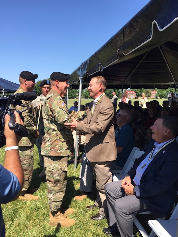 FORT KNOX, Kentucky (June 10, 2016) – Retired Col. Gerald W. Meyer, right, a U.S. Army Reserve Ambassador for Wisconsin and the 88th Regional Support Command, shakes hands with U.S. Army Cadet Command and Fort Knox Commanding General Maj. Gen. Christopher Hughes after Meyer was presented with a medallion honoring his selection as an inaugural member of the Cadet Command Hall of Fame during a ceremony June 10 at Fort Knox’s Brooks Field.
(U.S. Army photo provided by Col. Michael Holland, 88th Regional Support Command/Released)