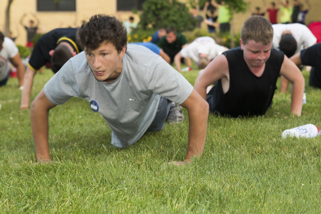 Lucas King, a native of New Hartford, N.Y., does pushups during physical training under the guidance of U.S. Marine Corps Cpl. Arkim Lewis, an administrative clerk with Marine Recruiting Station Albany, N.Y., as part of the American Legion New York Boys’ State at the Morrisville State University in Morrisville, N.Y., on Tuesday, June 28, 2016. Boys’ State brings together more than 1,100 selected high school seniors from across New York to learn and practice the democratic process. Ten Marines serve as mentors during the event, providing guidance and leadership to the young men during their daily activities. (U.S. Marine Corps photo by Sgt. James Marchetti/Released)