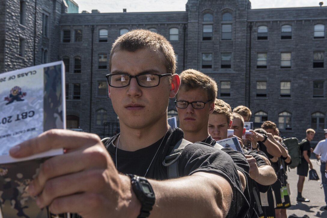 Future Cadets at the U.S. Military Academy at West Point, N.Y., study their Cadet Basic Training Smart Books during R-day, June 27. (U.S. Army photo by Sgt. 1st Class Brian Hamilton/ released)