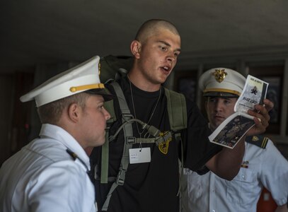 Future Cadets at the U.S. Military Academy at West Point, N.Y., study their Cadet Basic Training Smart Books during R-day, June 27. (U.S. Army photo by Sgt. 1st Class Brian Hamilton/ released)