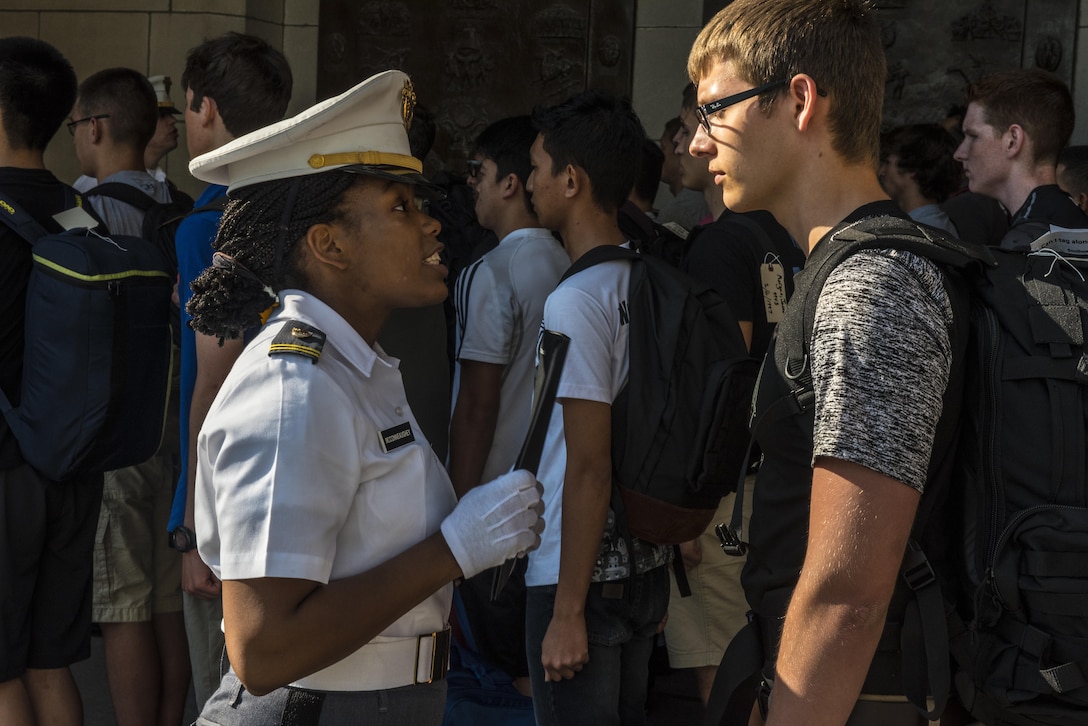 Cadet Ariana McConneauchey lectures a future Cadet on the importance of not leaving his personal items lying around in front of Thayer Hall at the U.S. Military Academy at West Point, N.Y., June 27. (U.S. Army photo by Sgt. 1st Class Brian Hamilton/ released)