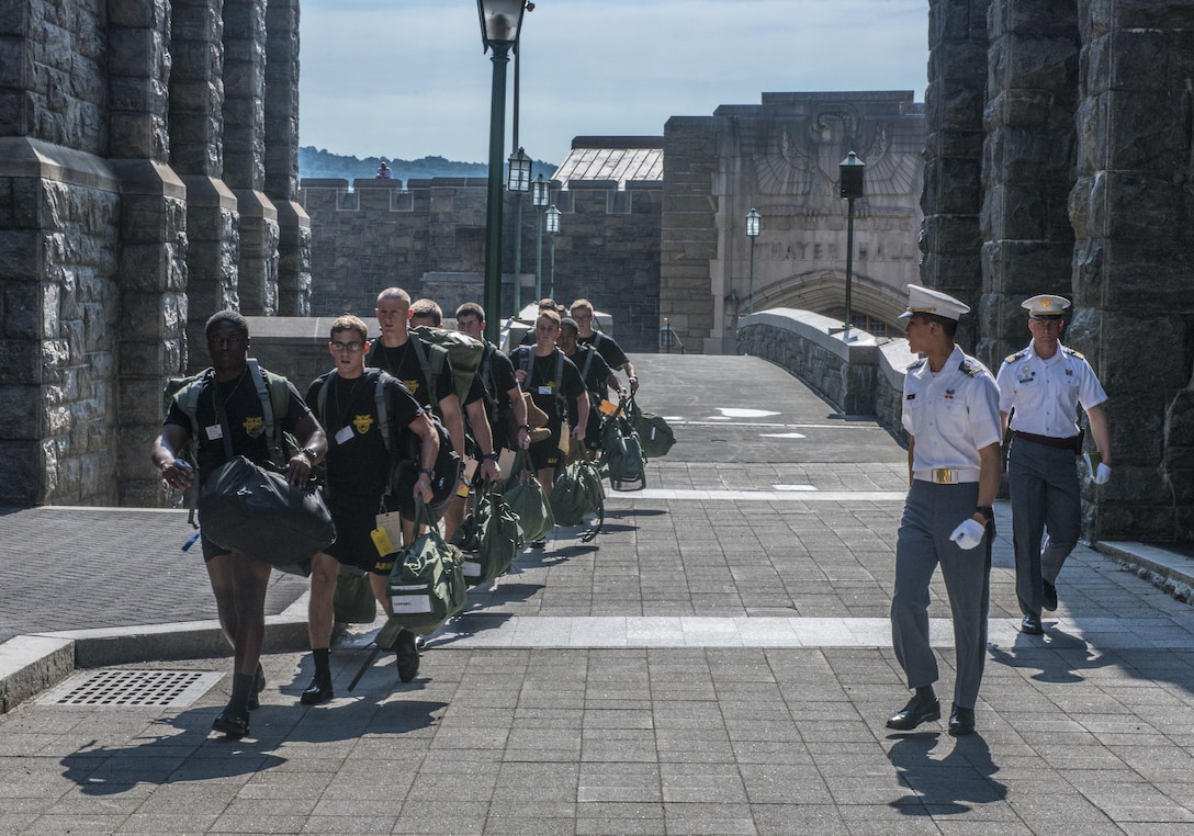 Future Cadets at the U.S. Military Academy at West Point, N.Y., scurry across a bridge to their next in-procesing station during R-day, June 27. (U.S. Army photo by Sgt. 1st Class Brian Hamilton/ released)