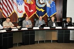 Marine Corps Maj. Gen. Vincent Coglianese, U.S. Marine Corps Installations and Logistics; Mike Scott;Tony Poleo; Jan Mulligan, Deputy Assistant Secretary of Defense for Supply Chain Integration; and Kathy Cutler listen to opening remarks at the 2016 Cost Summit.