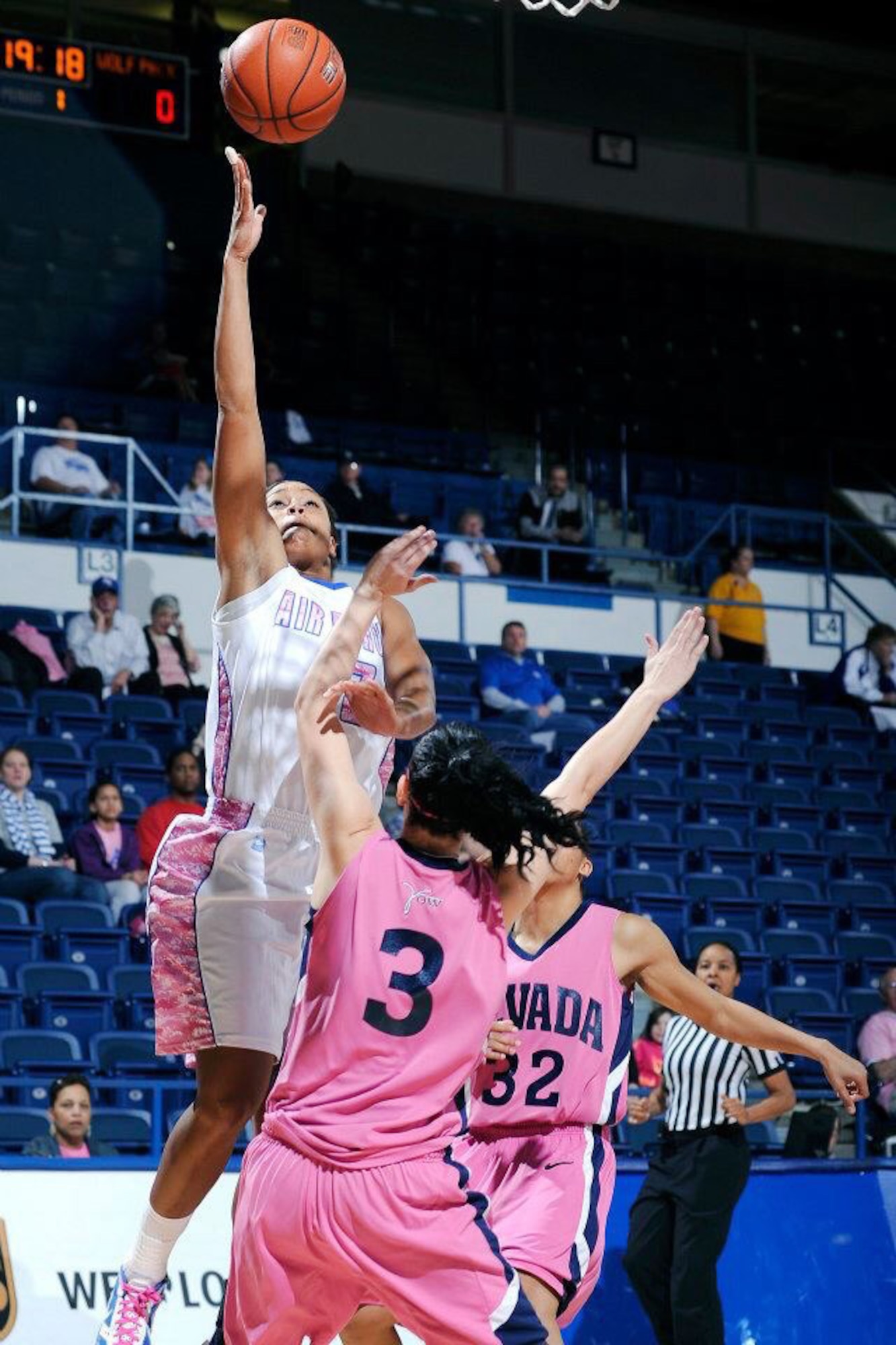 1st Lt. Dymond James, 460th Operations Group staff instructor, goes up for a layup against the University of Nevada during her 2012-2013 season on the Air Force Academy’s women’s basketball team. James recently made the U.S. Air Force Women’s Basketball Team and will compete against other branches of service. (Courtesy photo)