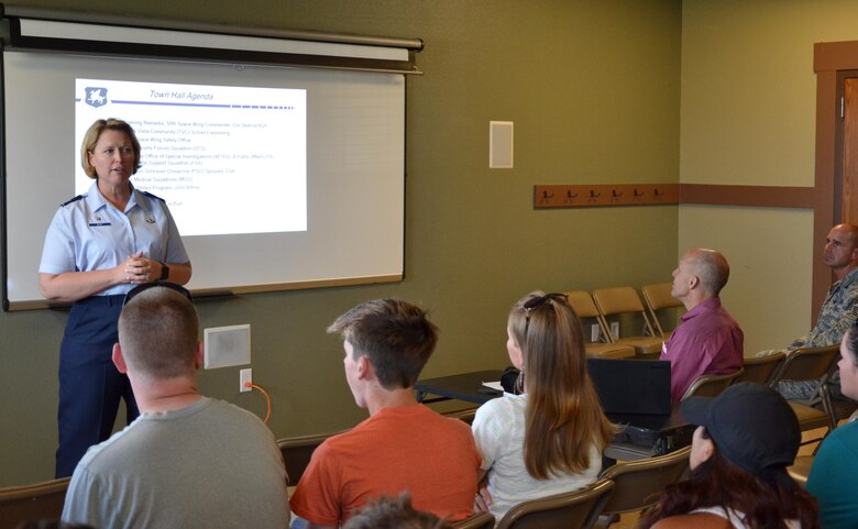 Col. DeAnna Burt, 50th Space Wing commander, speaks to housing residents during a town hall meeting at Schriever Air Force Base, Colorado, Monday, June 27, 2016. The town hall covered a variety of topics affecting housing residents including, safety, mosquito testing and the utility allowance policy change. (U.S. Air Force photo/Brian Hagberg)