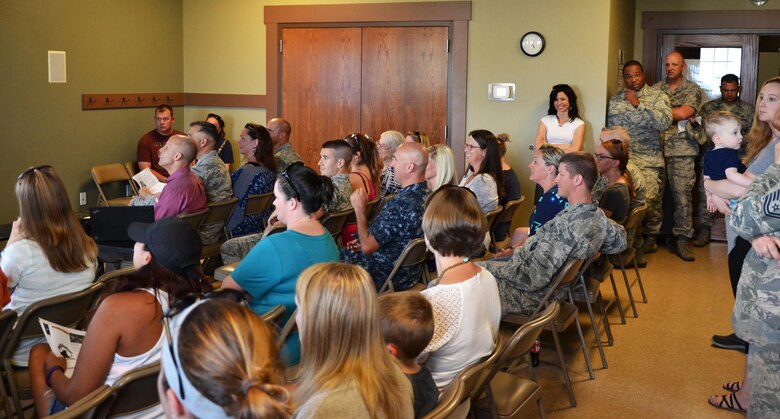 A standing room only crowd listens to a briefer during a town hall meeting at Schriever Air Force Base, Colorado, Monday, June 27, 2016. More than 40 residents attended the meeting to learn about current housing issues. (U.S. Air Force photo/Brian Hagberg)
