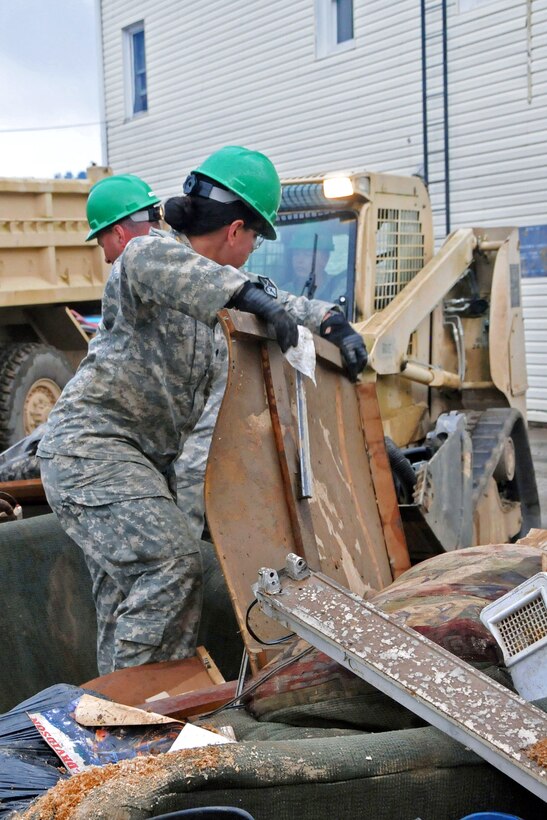 Soldiers help remove debris caused by flooding in Rainelle, W.Va., June 27, 2016. Army National Guard photo by Staff Sgt. Justin Hough