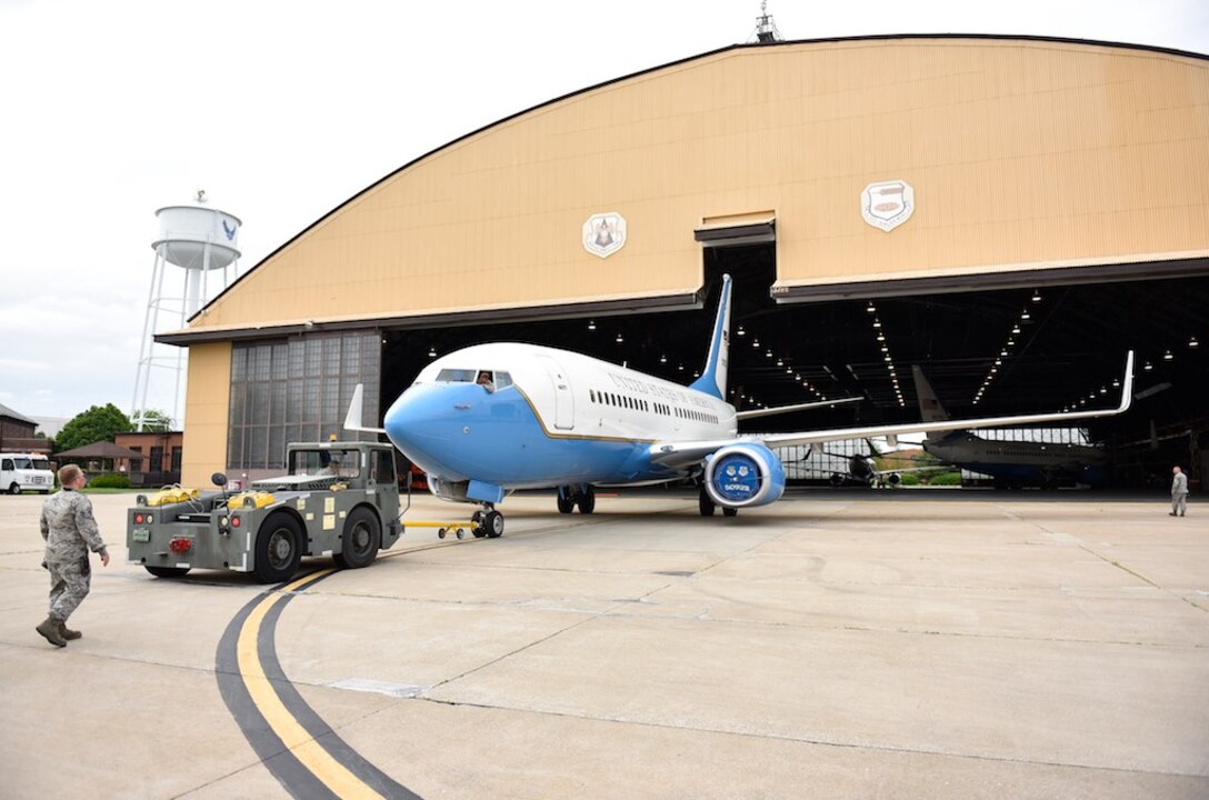 A 932nd Airlift Wing maintaining crew with the C-40C watches the clearance of a tail and performs a post flight visual inspection at Scott Air Force Base, Illinois. The 932nd Maintenance Group tows the plane inside the hangar and looks for any possible bird strike or rock damage that might have occurred during the flight. The 932nd Airlift Wing, an Air Force Reserve flying unit, is the only Reserve wing to fly the C-40C, operational support and team travel distinguished visitor aircraft worldwide. (U.S. Air Force photo by Christopher Parr)