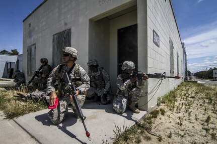 U.S. Army Reserve Soldiers from the 404th Civil Affairs Battalion provide security for a simulated casualty while waiting for a MEDEVAC helicopter during Exercise Gridiron at Joint Base McGuire-Dix-Lakehurst, N.J., June 27, 2016. (U.S. Air National Guard photo by Tech. Sgt. Matt Hecht/Released)