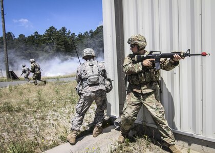 U.S. Army Reserve Soldiers from the 404th Civil Affairs Battalion provide cover for one another while crossing a field under enemy fire during Exercise Gridiron at Joint Base McGuire-Dix-Lakehurst, N.J., June 27, 2016. (U.S. Air National Guard photo by Tech. Sgt. Matt Hecht/Released)