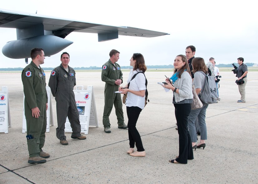 Members of the media, to include CNN, Air Force Times and Aviation Week, interact with members of the 53d Weather Reconnaissance Squadron during a C-130 Hercules special-mission demonstration on the Joint Base Andrews, Md., flight line June 28, 2016. In honor of the 100th anniversary of U.S. air reserve power, media members were invited to an event showcasing special missions conducted by C-130s in Air Force Reserve Command, to include weather surveillance, firefighting and aerial spraying. (U.S. Air Force photo/Staff Sgt. Kat Justen)