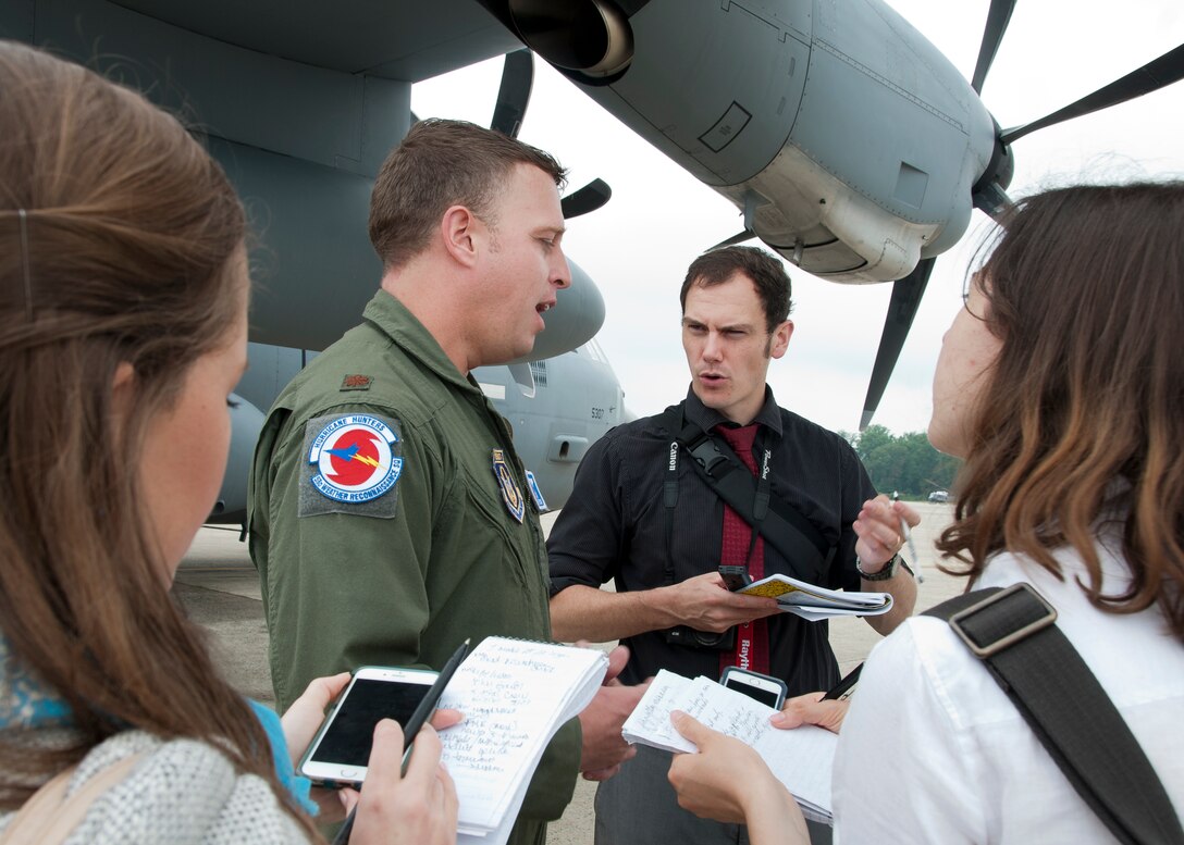 Major Kyle Larson, 53d Weather Reconnaissance Squadron “Hurricane Hunters” meteorologist, discusses his unit’s mission with media on the Joint Base Andrews, Md., flight line June 28, 2016. In honor of the 100th anniversary of air reserve power, members of the 53d WRS visited Andrews to participate in a C-130 Hercules special-missions demonstration. The 53d WRS is the only flying weather reconnaissance unit in the world with routine missions to survey tropical and winter storms. (U.S. Air Force photo/Staff Sgt. Kat Justen)