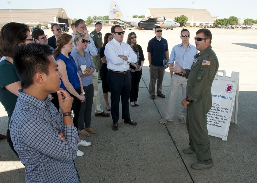 Major Brad Roundtree, 53d Weather Reconnaissance Squadron pilot, discusses his unit’s mission with congressional staff members on the Joint Base Andrews, Md., flight line June 28, 2016. In honor of the 100th anniversary of air reserve power, members of the 53d WRS visited Andrews to participate in a C-130 Hercules special-missions demonstration. The 53d WRS is the only flying weather reconnaissance unit in the world flying routine missions to survey tropical and winter storms. (U.S. Air Force photo/Staff Sgt. Kat Justen)