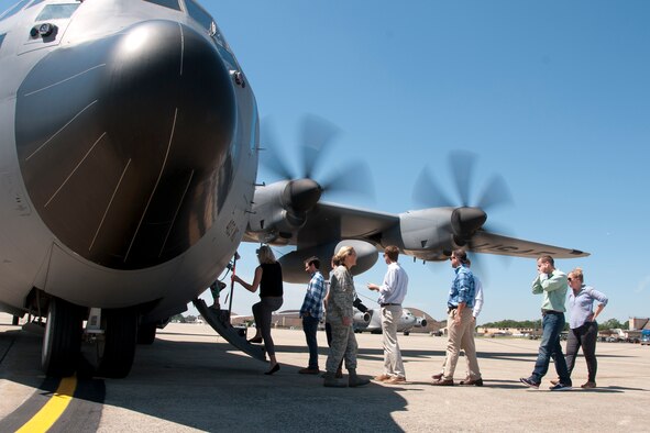Congressional staff members embark on a 53d Weather Reconnaissance Squadron C-130 Hercules on the Joint Base Andrews, Md., flight line June 29, 2016. In honor of the 100th anniversary of U.S. air reserve power, congressional staff members were invited to an event showcasing special missions conducted by C-130s in the Air Force Reserve Command, to include weather surveillance, firefighting and aerial spraying. (U.S. Air Force photo/Staff Sgt. Kat Justen)