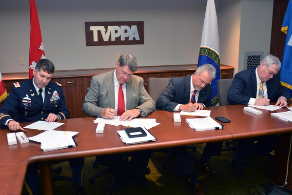 Lt. Col. Stephen Murphy, U.S. Army Corps of Engineers, Nashville District commander, Jack Simmons, Tennessee Valley Public Power Association, Inc., vice president, John McCormick, Tennessee Valley Authority, vice president of Safety, River Management and Environmental and Ken Legg, Southeastern Power Administration administrator sign a Memorandum of Agreement June 27, 2016, in Chattanooga, Tenn.  