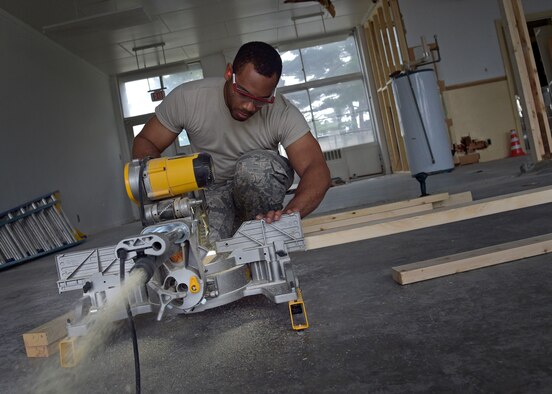U.S. Air Force Airman 1st Class Victor Blake, a structural journeyman with the 35th Civil Engineer Squadron, cuts blocks of wood during the renovation of the Arts and Crafts Center at Misawa Air Base, Japan, June 27, 2016. Blake and other structures Airmen have been working on this project to combine the building and its annex since April 2016. The finished product will showcase a larger work center to accommodate both facilities. (U.S. Air Force photo by Senior Airman Deana Heitzman)