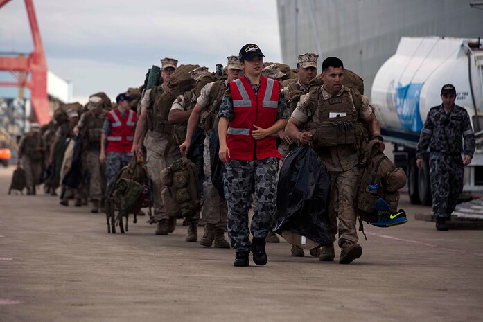U.S. Marines prepare to go aboard the HMAS Adelaide at Port of Brisbane, Queensland, Australia, June 16, 2016. This marks the first time Marines and sailors from Marine Rotational Force - Darwin have embarked in such numbers on an Australian HMAS. This opportunity allows for MRF-D to expand the partnership capabilities with our Australian allies. The Marines are with 1st Battalion, 1st Marine Regiment, MRF-D, and the Australians are with HMAS Adelaide. 