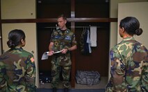 Civil Air Patrol Capt. Michael Kelly, CAP alpha flight tactical officer, talks to cadets after completing a dorm inspection at the CAP summer encampment at Yokota Air Base, Japan, June 23, 2016. In addition to the dorm inspection, the cadets also received a uniform inspection. (U.S. Air Force photo by Senior Airman David Owsianka/Released)