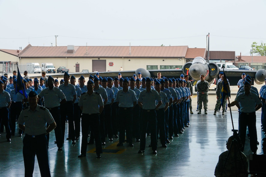 Airmen from the 694th Intelligence, Surveillance and Reconnaissance Group stand in formation during a change of command ceremony at Osan Air Base, Republic of Korea. Col. James Mock accepted command of the 694th ISRG during the ceremony after previously living in Korea as a young student 30 years ago. (U.S. Air Force photo by Senior Airman Dillian Bamman/Released)