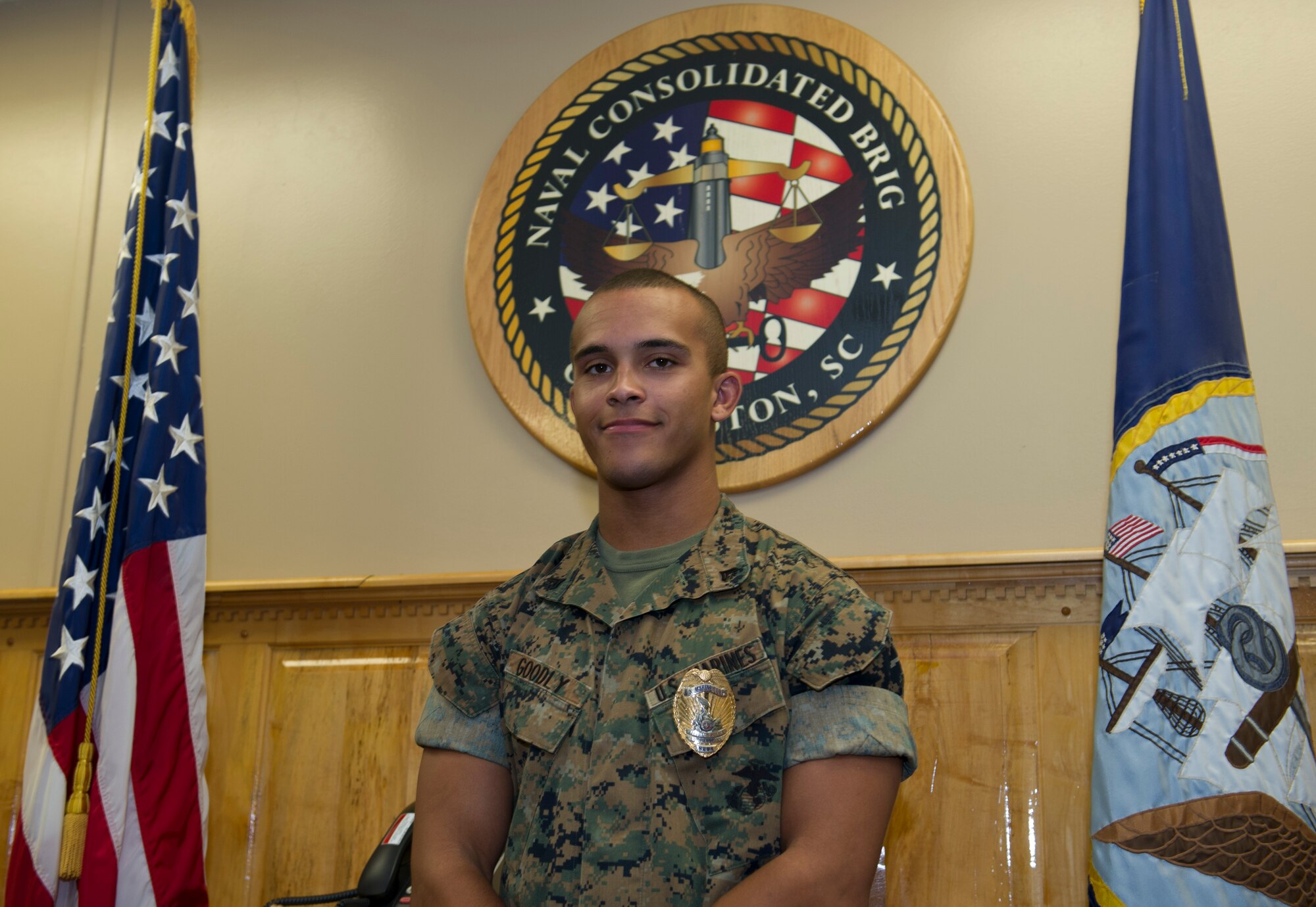 Cpl. Ryan Goodly, the Naval Consolidated Brig lock-smith on Joint Base Charleston – Naval Weapons Station poses for a photograph in the conference room June 28, 2016. Goodly plans to celebrate this Independence Day with his girlfriend and her family. (U.S. Air Force photo/Airman 1st Class Kevin West)