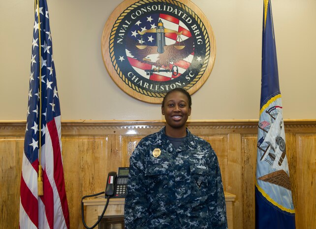 Yeoman First 1st Class Kealy Lee, an administrative assistant for the Admin Officer at the Naval Consolidated Brig at Joint Base Charleston – Naval Weapons Station poses for a photograph in the conference room June 28, 2016. Independence Day means a time to celebrate everything that our forefathers and everyone that went before us, to allow us to be able to join the military as a result of their sacrifices for our freedom. (U.S. Air Force photo/Airman 1st Class Kevin West)