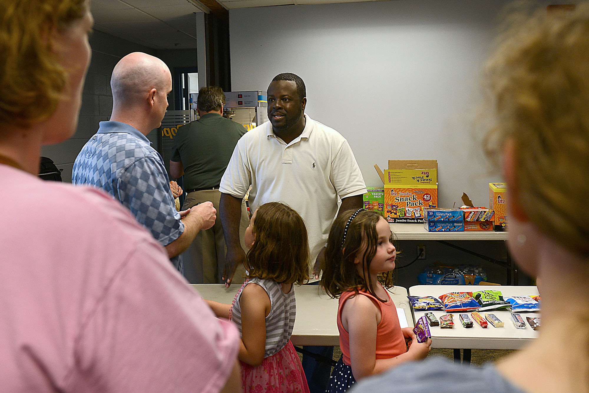 James Murrell, 633rd Force Support Squadron community programs director, takes orders for concessions at the first “Best of the Big Screen” movie night at the base theater at Langley Air Force Base. Va., June 24, 2016. The squadron brought back movie nights due to requests from military community members. (U.S. Air Force photo by Staff Sgt. Teresa J. Cleveland)