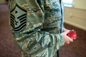 U.S. Air Force Master Sgt. Scott Alloway, 633rd Medical Group first sergeant, handed out gift cards to junior-enlisted Airmen during a Random Acts of Kindness campaign at the Dining Facility at Langley Air Force Base, Va., June 21, 2016. Since its inception in 2012, the First Sergeants Council used the RAK campaign to distribute more than $66,000 to members of the Langley Air Force Base community. (U.S. Air Force photo by Staff Sgt. R. Alex Durbin)