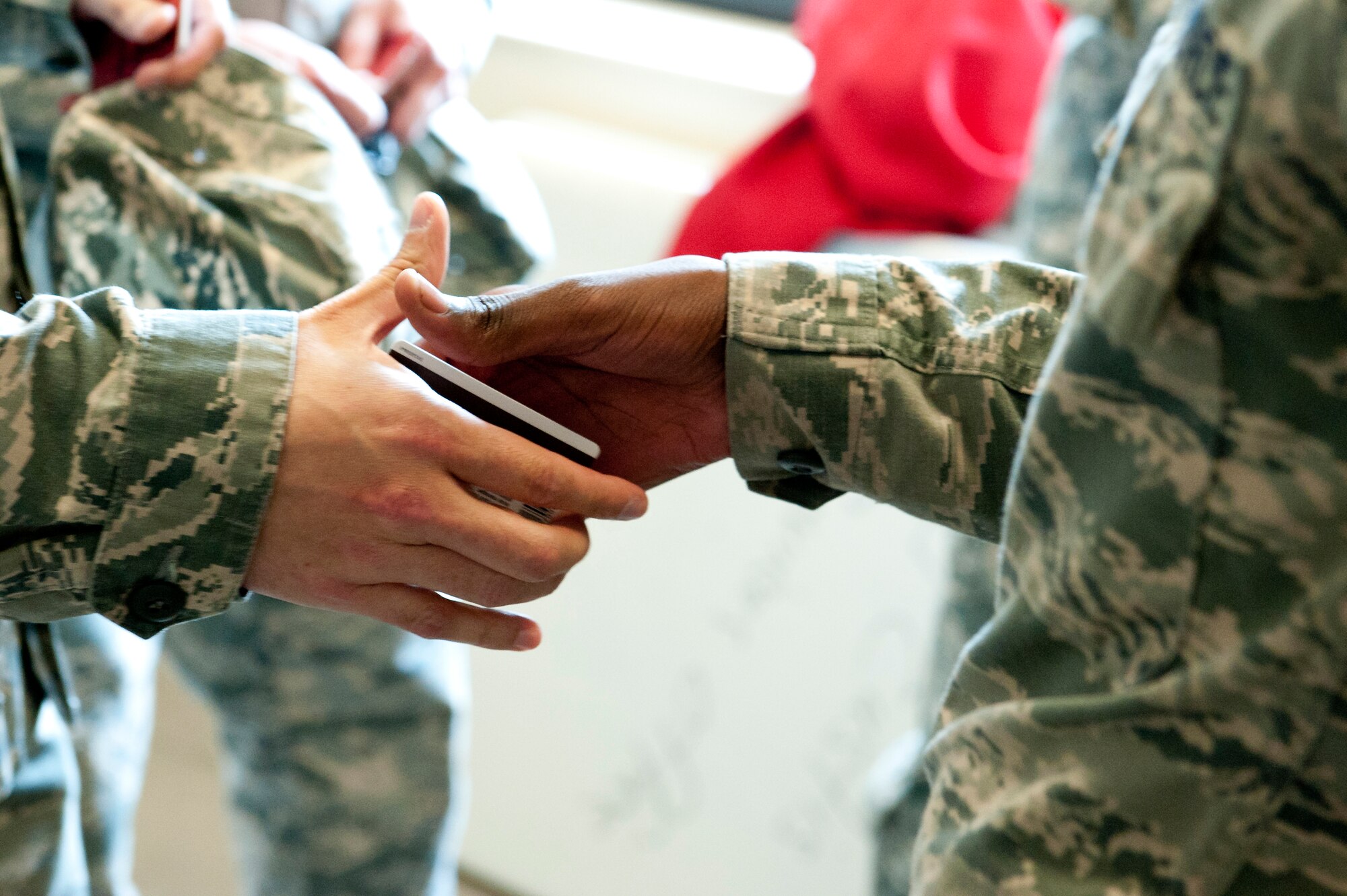 First sergeants handed out 100 $10 gift cards to junior-enlisted Airmen as part of a Random Acts of Kindness campaign at Langley Air Force Base, Va., June 21, 2016. The campaign strives to increase morale and thank Airmen for their service by distributing First Sergeants Council funds back to the base community. (U.S. Air Force photo by Staff Sgt. R. Alex Durbin)