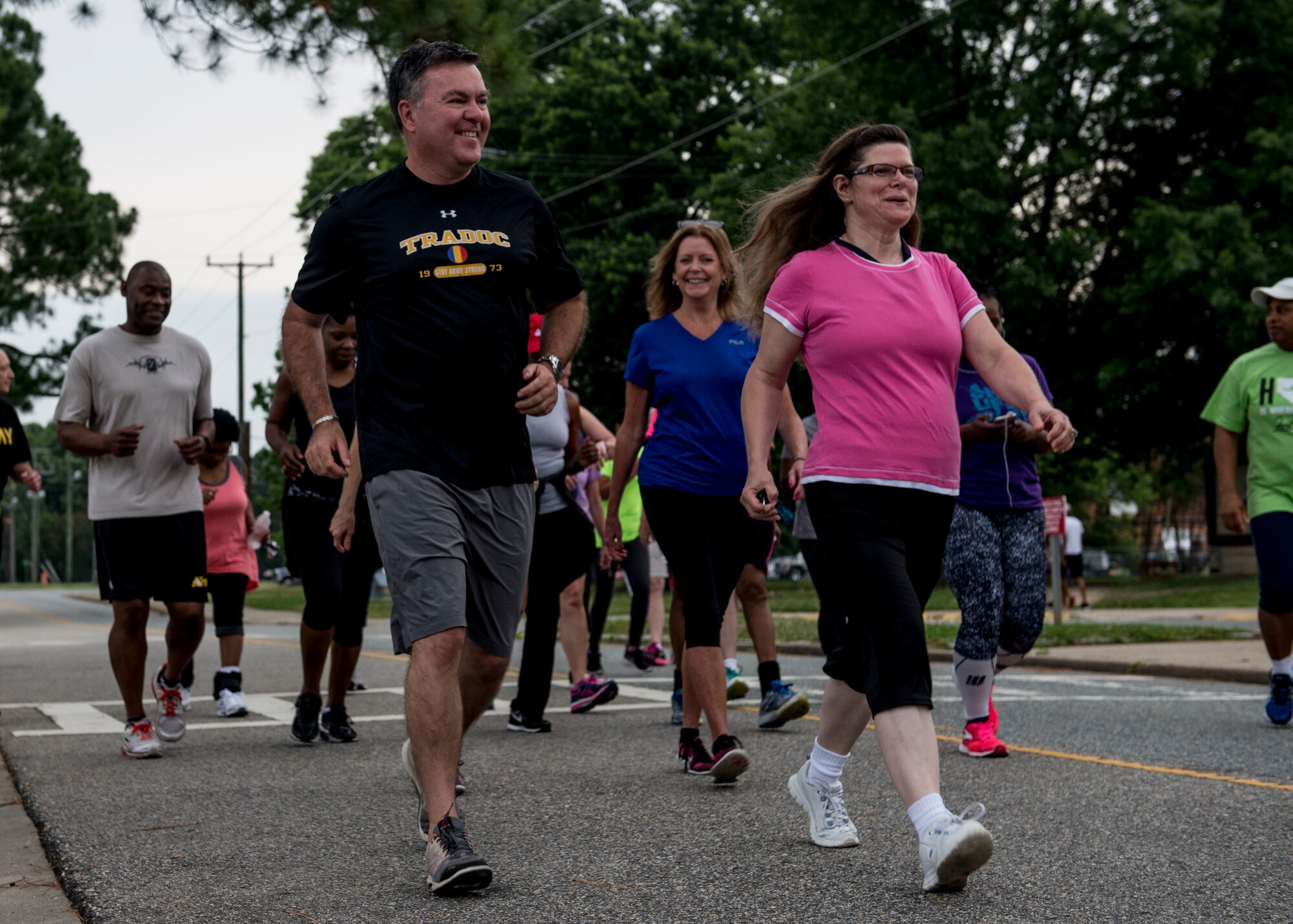 Hubert Davis, Headquarters Training and Doctrine Command assistant deputy chief of staff, begins the final 5K run for the Civilian Commanders Cup Fitness Challenge alongside other participants at Fort Eustis, Va., June 23, 2016. The challenge was open to all Eustis personnel, competing to see who could reduce their 5K run time the most. (U.S. Air Force photo by Airman 1st Class Derek Seifert)