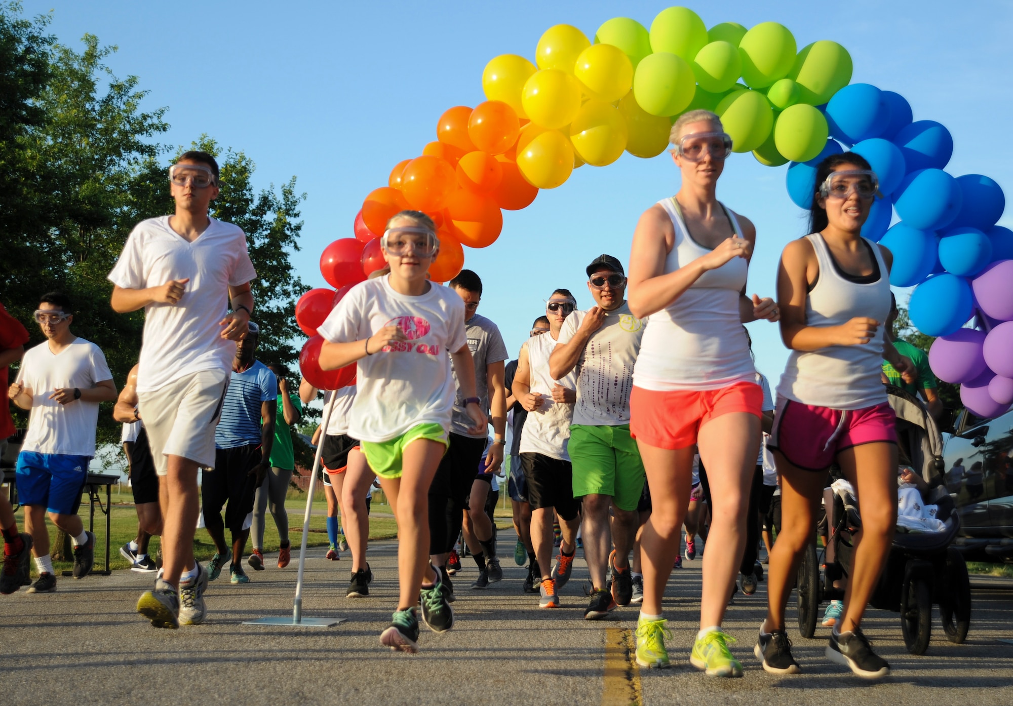 Participants begin running the Lesbian, Gay, Bisexual and Transgender (LGBT) Pride Month Rainbow Run 5K at Whiteman Air Force Base, Mo., June 24, 2016. A total of 75 people participated in the run and showed their support to the LGBT community. (U.S. Air Force photo by Senior Airman Danielle Quilla)