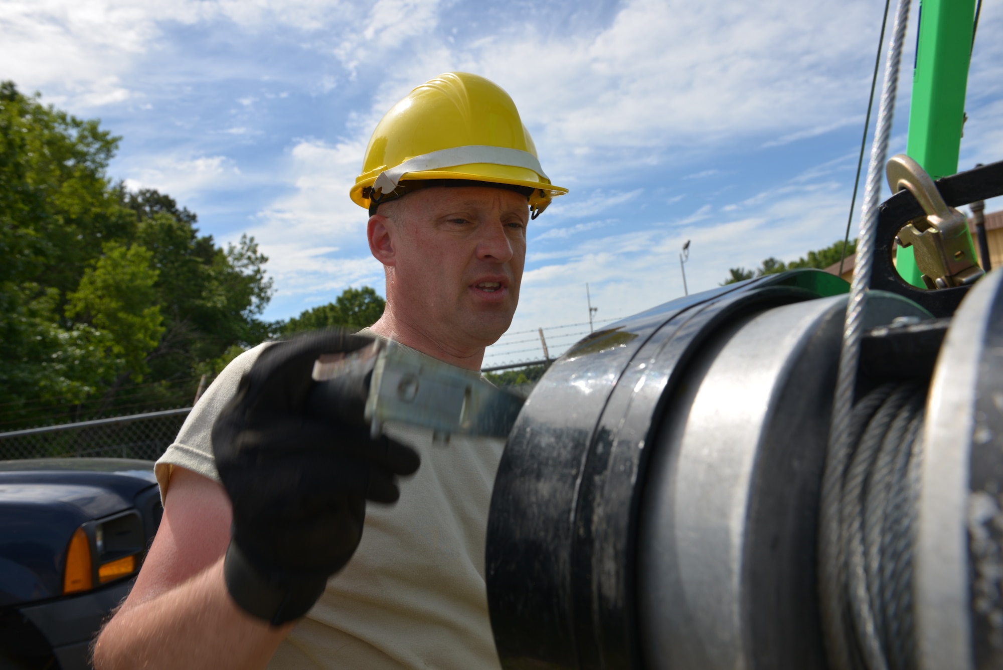 Senior Airmen Mark Chapman, 243rd Engineering Installation Squadron radio frequency transmission technician, removes outdated coaxial cable and obsolete fiber optic cable from various manholes at Pease Air National Guard Base, N.H., June 17. The team from Portland, M.E. has assisted the 157th Communications Flight with removing over 20,000 feet of cable from manholes at Pease ANGB. (U.S. Air National Guard photo by Tech. Sgt. Erica Rowe)