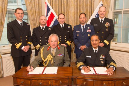 U.S. Navy Adm. Cecil D. Haney, U.S. Strategic Command (USSTRATCOM) commander (seated right), and U.K. Royal Marines Gen. Gordon Messenger, Vice Chief of the Defence Staff, pose for a photo to commemorate their signing a memorandum of understanding (MOU) at the U.K. Ministry of Defence (MOD) Headquarters, London, June 28, 2016. By signing the MOU, Haney and Messenger formally agreed to continue having a U.K. liaison officer assigned to USSTRATCOM Headquarters. U.K. Royal Navy Capt. Richard Daws (standing, second from left) currently serves as the U.K. liaison officer at USSTRATCOM, where he coordinates the collaborative efforts between USSTRATCOM and the U.K. MOD. The engagement is part of Haney's trip to the U.S. European Command area of responsibility to meet with host-nation leaders as part of USSTRATCOM's ongoing effort to build, support and sustain partnerships with ally nations. Also pictured (standing left to right) are: U.K. Royal Navy Commodore John MacDonald, U.K. Ministry of Defence head of chemical, biological, radiological and nuclear policy; Daws; U.K. Royal Navy Rear Adm. Mark Beverstock, Assistant Chief of the Defence Staff; U.S. Air Force Brig. Gen. John E. Shaw, USSTRATCOM deputy director of global operations; and U.S. Navy Rear Adm.  Steve Parode, USSTRATCOM director if intelligence. One of nine DoD unified combatant commands, USSTRATCOM has global strategic missions, assigned through the Unified Command Plan, which include strategic deterrence; space operations; cyberspace operations; joint electronic warfare; global strike; missile defense; intelligence, surveillance and reconnaissance; combating weapons of mass destruction; and analysis and targeting. (Photo courtesy of U.K. Royal Air Force Sgt. Ross Tilly)