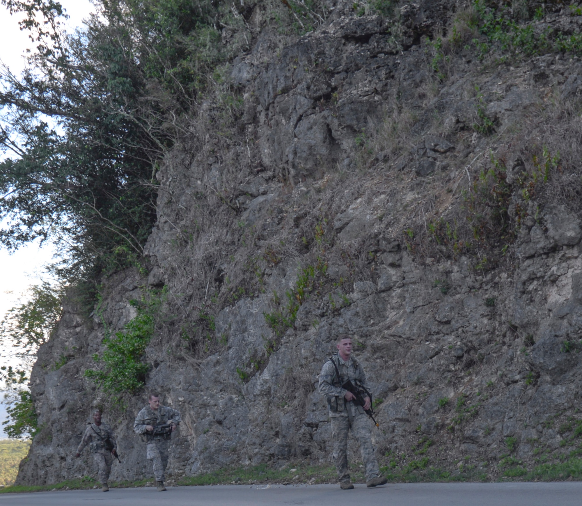 Airmen walk up Sanders Slope June 15, 2016, at Andersen Air Force Base, Guam. The trainees were individually selected from several career fields across the Department of Defense, including Airmen from the 36th Security Forces Squadron, 736th SFS, 554th RED HORSE Squadron, 644th Combat Communications Squadron and infantrymen from the 94th Army Air and Missile Defense Command’s Task Force Talon. (U.S. Air Force photo by Tech. Sgt. Richard Ebensberger)