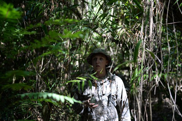 Airman 1st Class Scott Marvin, Jungle Training Operations Course student from the 36th Security Forces Squadron, navigates through the jungle using a compass June 16, 2016, in Barrigada, Guam. The trainees were individually selected from several career fields across the Department of Defense, including Airmen from the 36th Security Forces Squadron, 736th SFS, 554th RED HORSE Squadron, 644th Combat Communications Squadron and infantrymen from the 94th Army Air and Missile Defense Command’s Task Force Talon. (U.S. Air Force photo by Tech. Sgt. Richard Ebensberger)