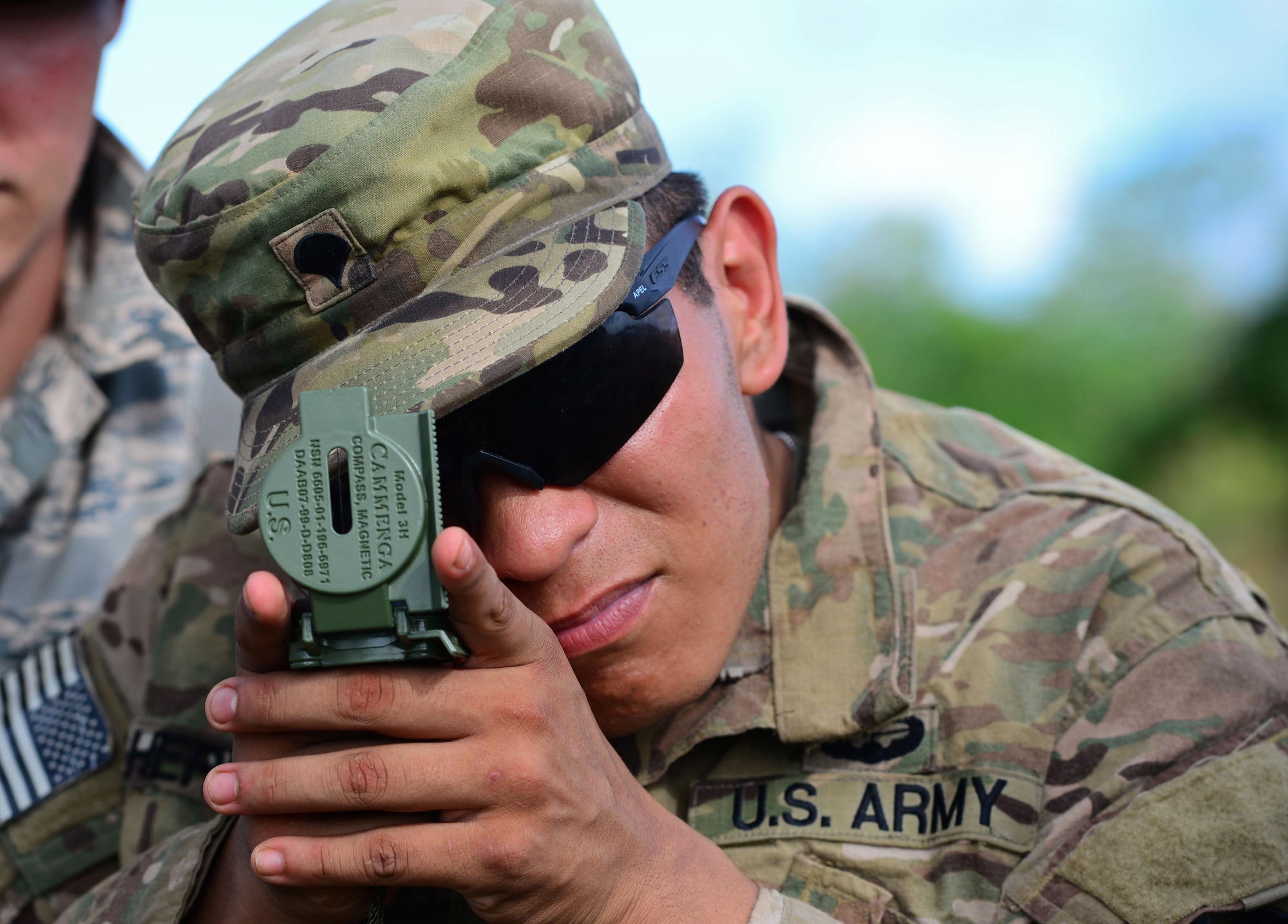 U.S. Army Spc. Matthew Hernandez, Jungle Training Operations Course student from the 94th Army Air and Missile Defense Command’s Task Force Talon, takes a compass reading June 16, 2016, at Andersen Air Force Base South, Guam. Conducted by the U.S. Army 25th Infantry Division's Lightning Academy Jungle Operations Training Center from Schofield Barracks, Hawaii, and supported by 736th Security Forces Squadron Commando Warrior cadre, more than 30 Airmen and Soldiers learned the fundamentals of survival skills, including land navigation and evasion techniques. (U.S. Air Force photo by Senior Airman Joshua Smoot)