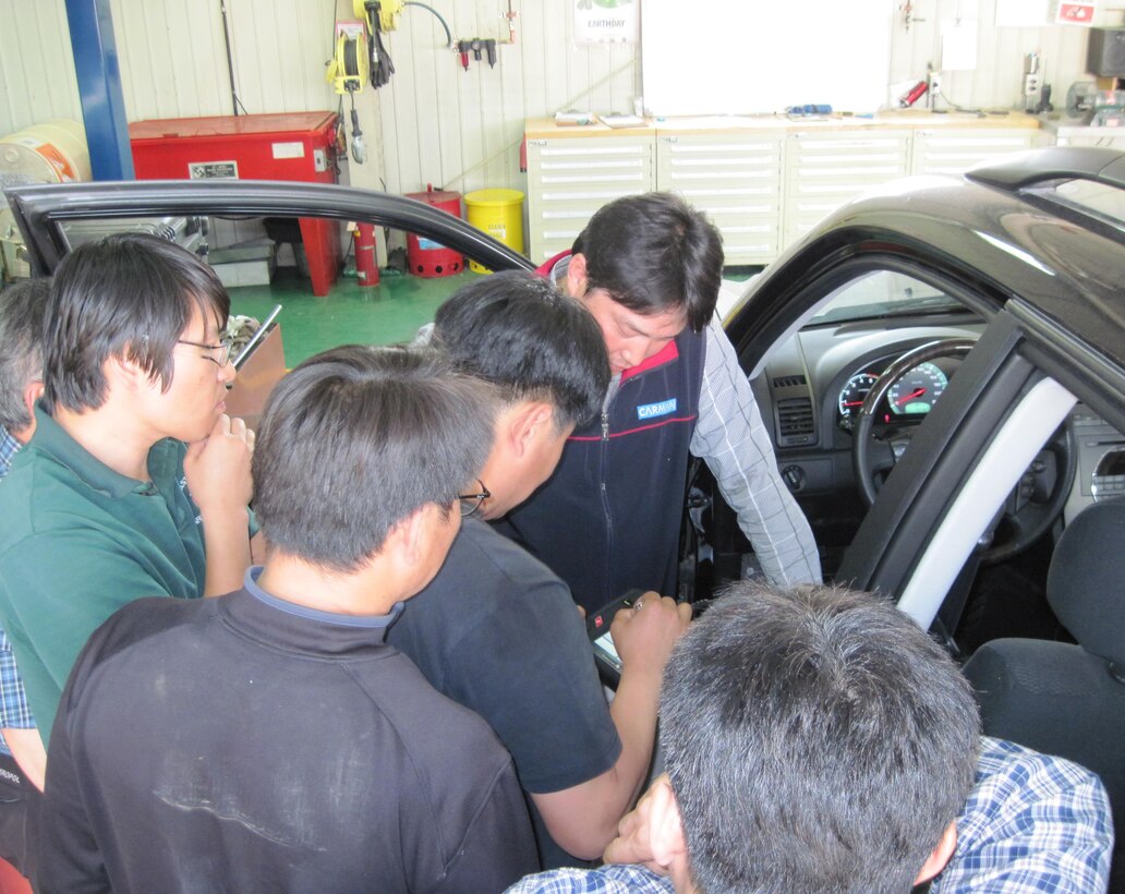 Mechanics of the Far East District's motor pool avail themselves of local training in order to stay informed and up-to-date with recent developments in automotive mechanics and electric vehicle technologies.