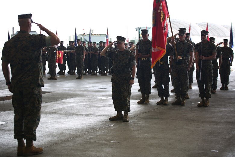 U.S. Marine Corps. Lt. Col. James S. Whiteker, center, Marine Wing Support Squadron (MWSS) 171 commanding officer, salutes Col. Daniel Shipley, Marine Aircraft Group 12 commanding officer,  during a change of command ceremony at Marine Corps Air Station Iwakuni, Japan, June 30, 2016. Whiteker relinquished his duties as MWSS-171 commanding officer to Lt. Col. Jason B. Berg after serving as the squadron commander for two years. (U.S. Marine Corps Photo by Jessica Quezada/Released)
