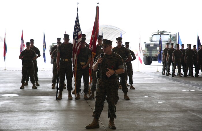 U.S. Marine Corps Lt. Col. James S. Whiteker, Marine Wing Support Squadron (MWSS) 171 commanding officer, addresses the audience during his change of command ceremony at Marine Corps Air Station Iwakuni, Japan, June 30, 2016. Whiteker relinquished his duties as MWSS-171 commanding officer to Lt. Col. Jason B. Berg after serving as the squadron commander for two years. Whiteker notably led MWSS-171 to unprecedented levels of support for essential exercises, operations and humanitarian assistance efforts across the Pacific. For his efforts as the squadron commanding officer, Whiteker received the meritorious service medal gold star in lieu of a fourth award. (U.S. Marine Corps Photo by Sgt. Jessica Quezada/Released)