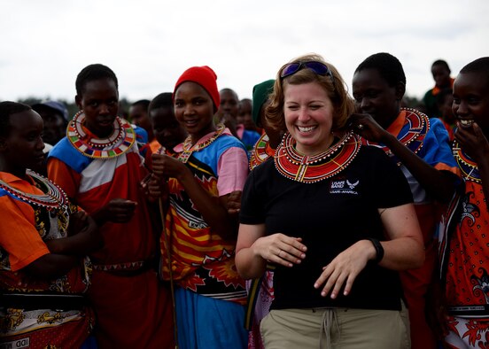 U.S. Air Force Senior Airman Carmen Emborski, U.S. Air Forces in Europe and Air Forces Africa band vocalist performs during a medical outreach event June 22, 2016 at Lokusero, Kenya.  The band performed during a three-day medical outreach as part of the first African Partnership Flight in Kenya. The APF is designed for U.S. and African partner nations to work together in a learning environment to help build expertise and professional knowledge and skills. (U.S. Air Force photo by Tech. Sgt. Evelyn Chavez/Released)
