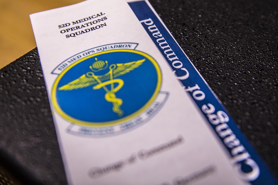 A 52nd Medical Operations Squadron change of command brochure rests on a countertop before the start of the 52nd MDOS change of command ceremony at the Brickhouse on Spangdahlem Air Base, Germany, June 29, 2016. U.S. Air Force Col. Patricia John, former 52nd MDOS commander, exchanged command of the squadron over to U.S. Air Force Lt. Col. Rebecca Elliott, 52nd MDOS commander. (U.S. Air Force photo by Senior Airman Luke Kitterman/Released) 