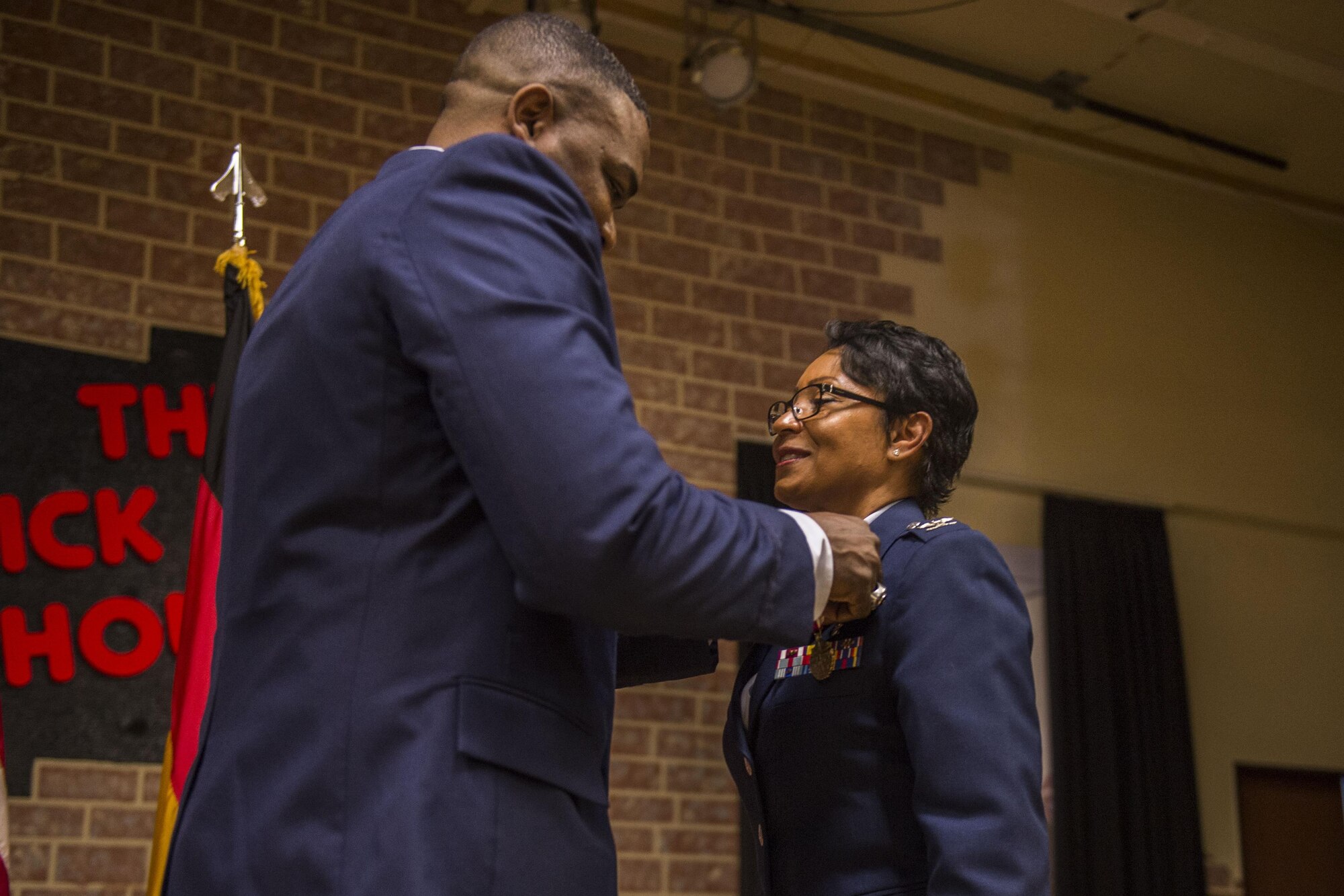 U.S. Air Force Col. Alfred Flowers, 52nd Medical Group commander, left, pins a Meritorious Service Medal on U.S. Air Force Col. Patricia John, former 52nd Medical Operations Squadron commander, during the 52nd MDOS change of command ceremony at the Brickhouse on Spangdahlem Air Base, Germany, June 29, 2016. The Meritorious Service Medal is awarded to members of the Armed Forces of the United States and friendly foreign nations who distinguished themselves by outstanding noncombat meritorious achievement. (U.S. Air Force photo by Senior Airman Luke Kitterman/Released)
