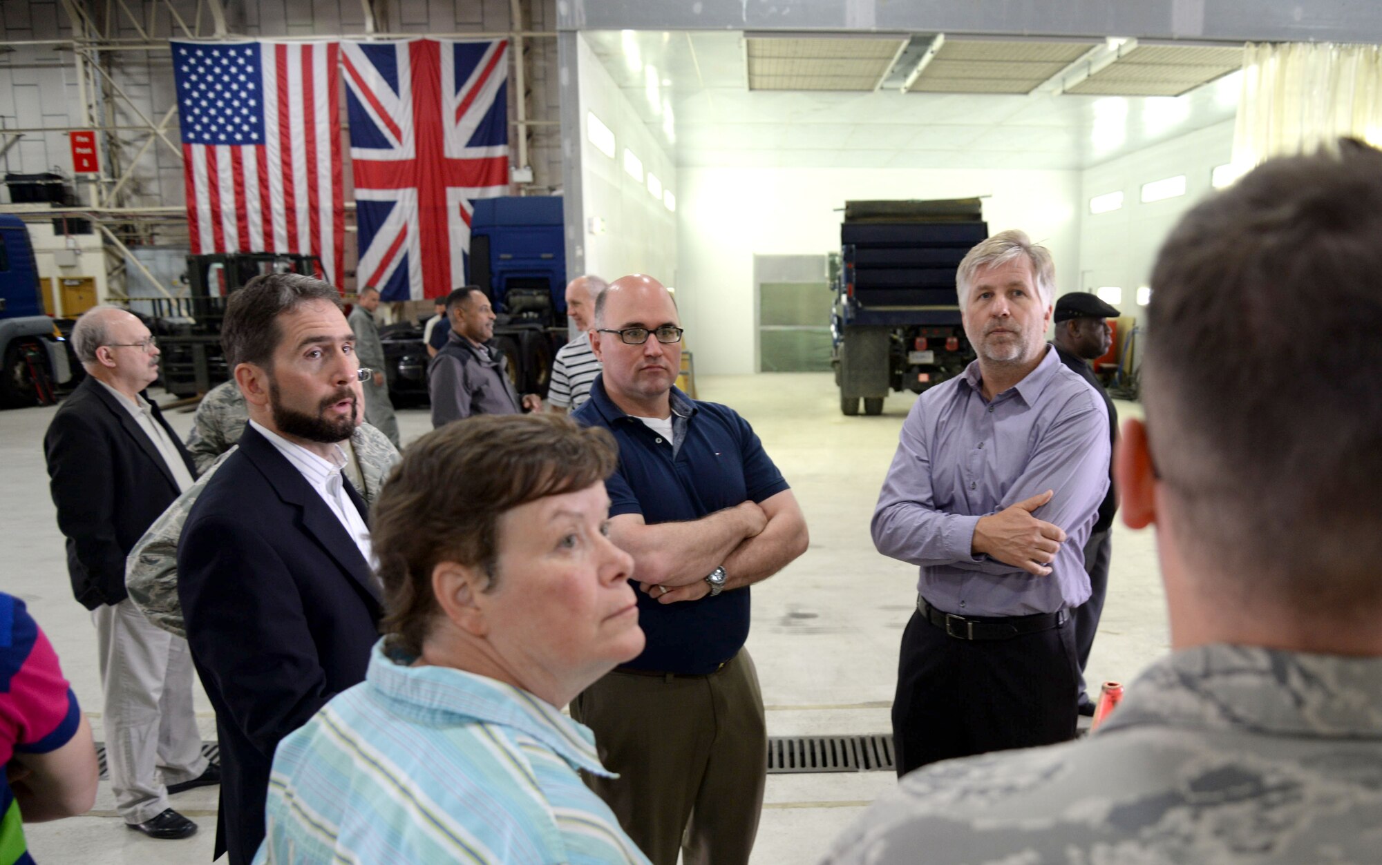Members of various U.S. and U.K. organizations supporting RAF Mildenhall complete a Chemical Weapons Convention Challenge Inspection Exercise June 29, 2015, by testing an exit control point on RAF Mildenhall. RAF Mildenhall was chosen for a challenge inspection testing compliance with the CWC. The base is expected to demonstrate compliance by providing the inspection team access to all requested areas and suggesting facilities that should be inspected. (U.S. Air Force photo by Staff. Sgt. Kate Thornton/Released)