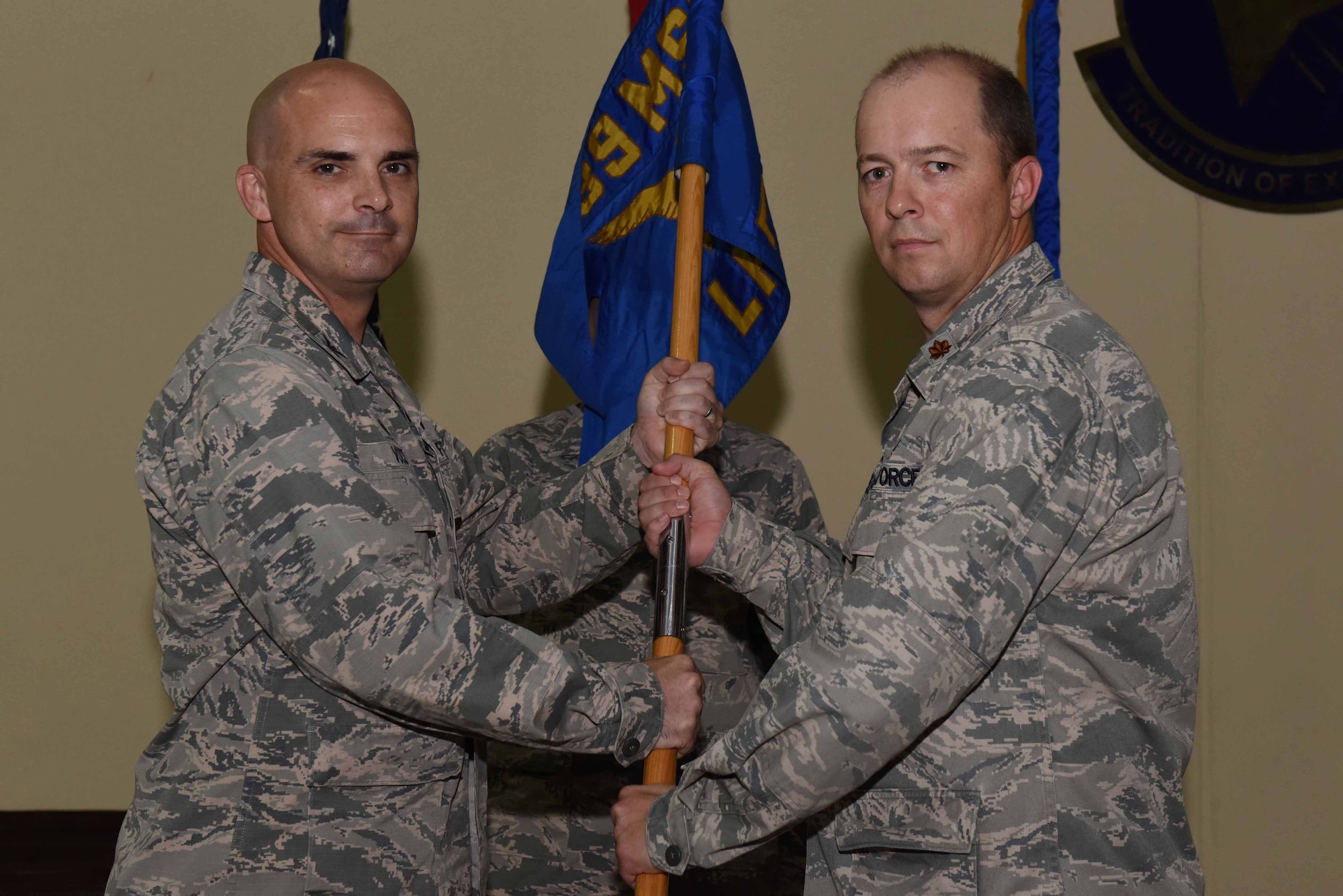 U.S. Air Force Maj. Phillip Wheeler, 39th Logistics Readiness Squadron incoming commander receives the guidon from U.S. Air Force Col. Russell Voce, 39th Mission Support Group commander, during an assumption of command ceremony on June 30, 2016 at Incirlik Air Base, Turkey. Prior to taking command here, Wheeler was the 97th LRS commander at Altus Air Force Base, Oklahoma. (U.S. Air Force photo by Airman 1st Class Devin M. Rumbaugh/Released)