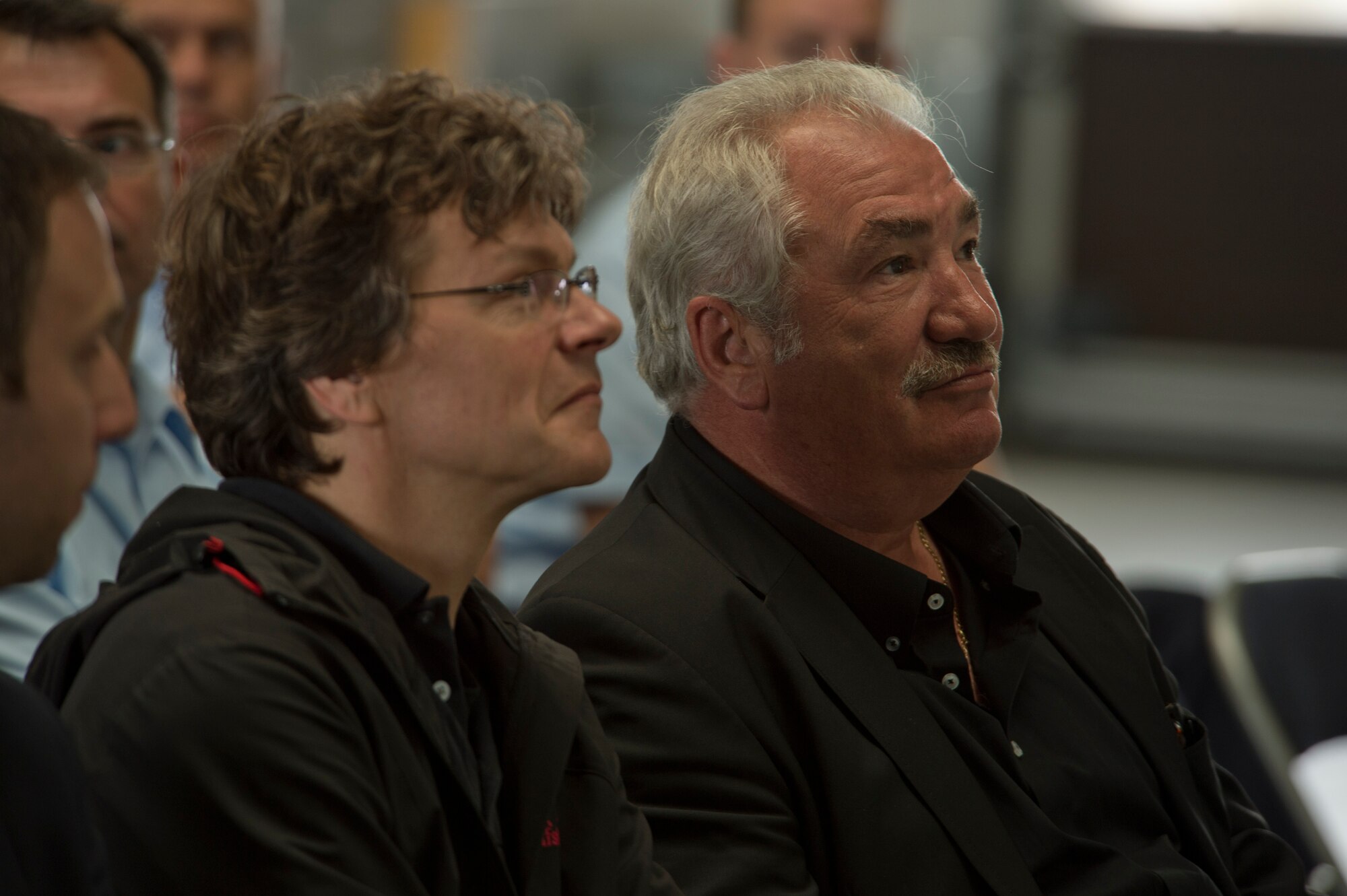 Local German community leaders listen to a presentation about CV-22 Osprey tilt-rotor aircraft assigned to the 352nd Special Operations Wing during a visit on the flightline near the 726th Air Mobility Squadron at Spangdahlem Air Base, Germany, June 28, 2016. The 352nd SOW, currently stationed at Royal Air Force Mildenhall, United Kingdom, will relocate to Spangdahlem as part of the European Infrastructure Consolidation realignment slated over the coming years. (U.S. Air Force Photo by Staff Sgt. Joe W. McFadden/Released)